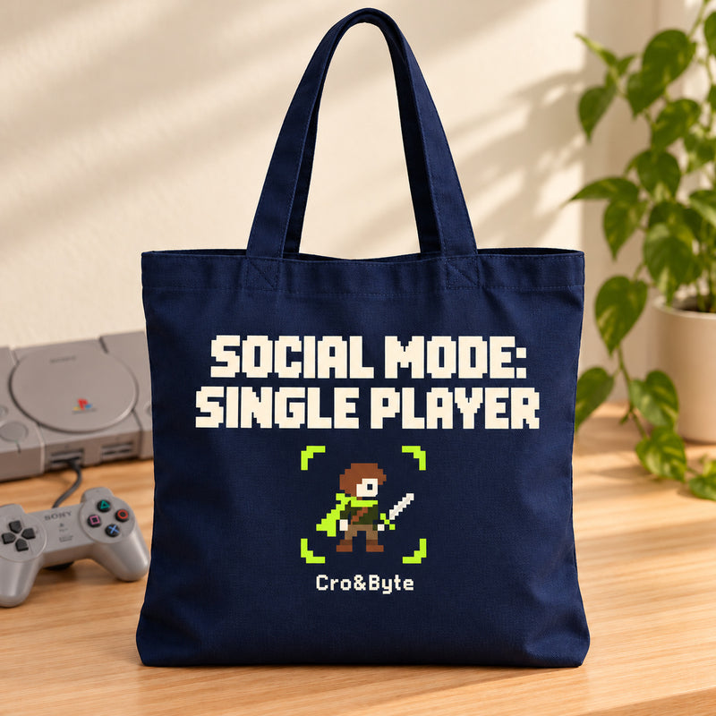 Social Mode: Single Player — Tote Bag — styled product photo with matching original PlayStation console and controller