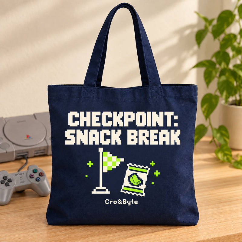 Checkpoint: Snack Break — Tote Bag — styled product photo with matching original PlayStation console and controller