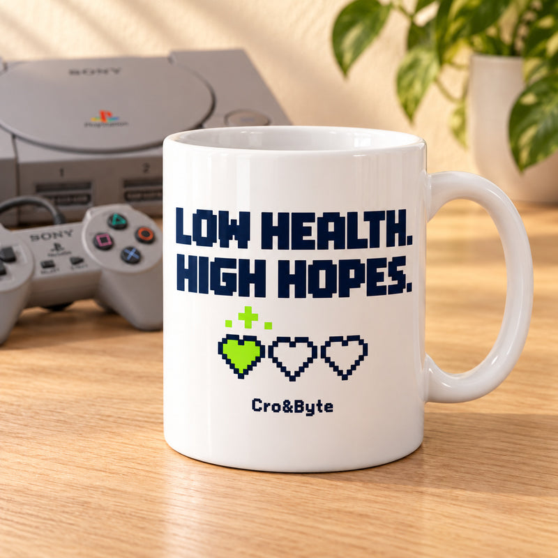 Low Health. High Hopes. — Mug — styled product photo with matching original PlayStation console and controller